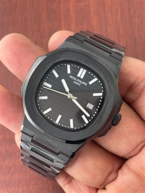 black patek philippe nautilus black face arabic numbers|Patek Philippe price.